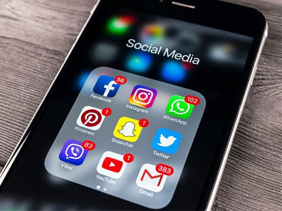 Social media app icons on a smartphone screen