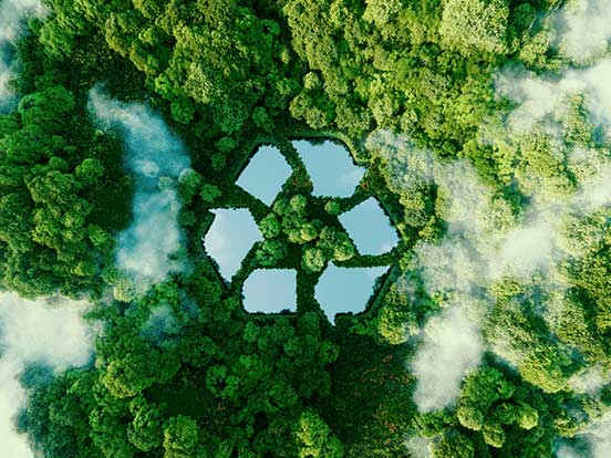 Rerycling symbol shaped lake in forest