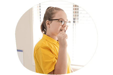 Child brushing her teeth before going to school