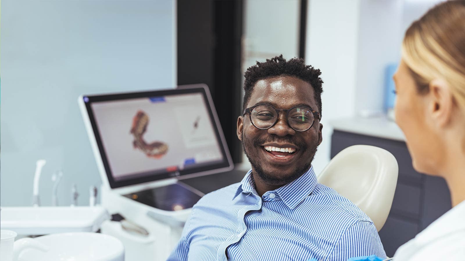 Man smiling in dentist chair