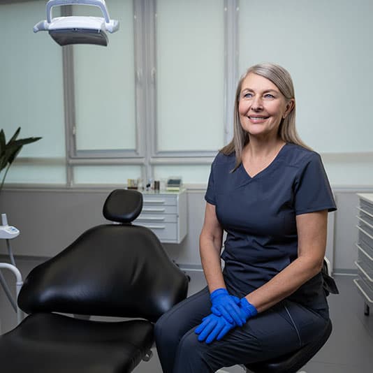 Smiling lady dentist in practice